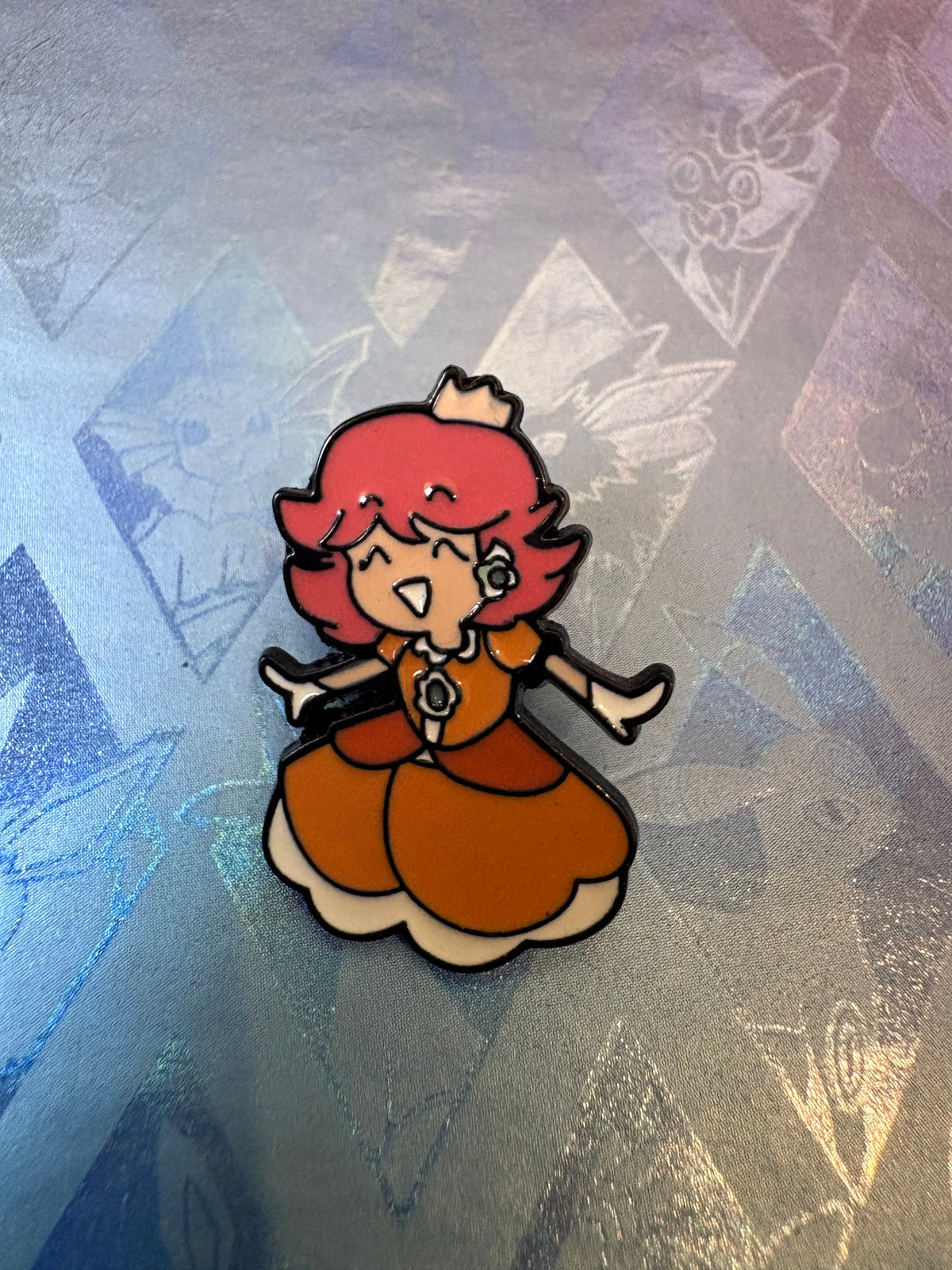 Pin metálico Daysi